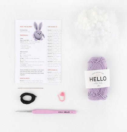 Crochet kit with lavender yarn, pattern, hook, and small bunny illustration